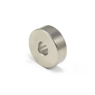 Metallic silver neodymium ring magnet with a center hole casting a soft shadow on a white background.